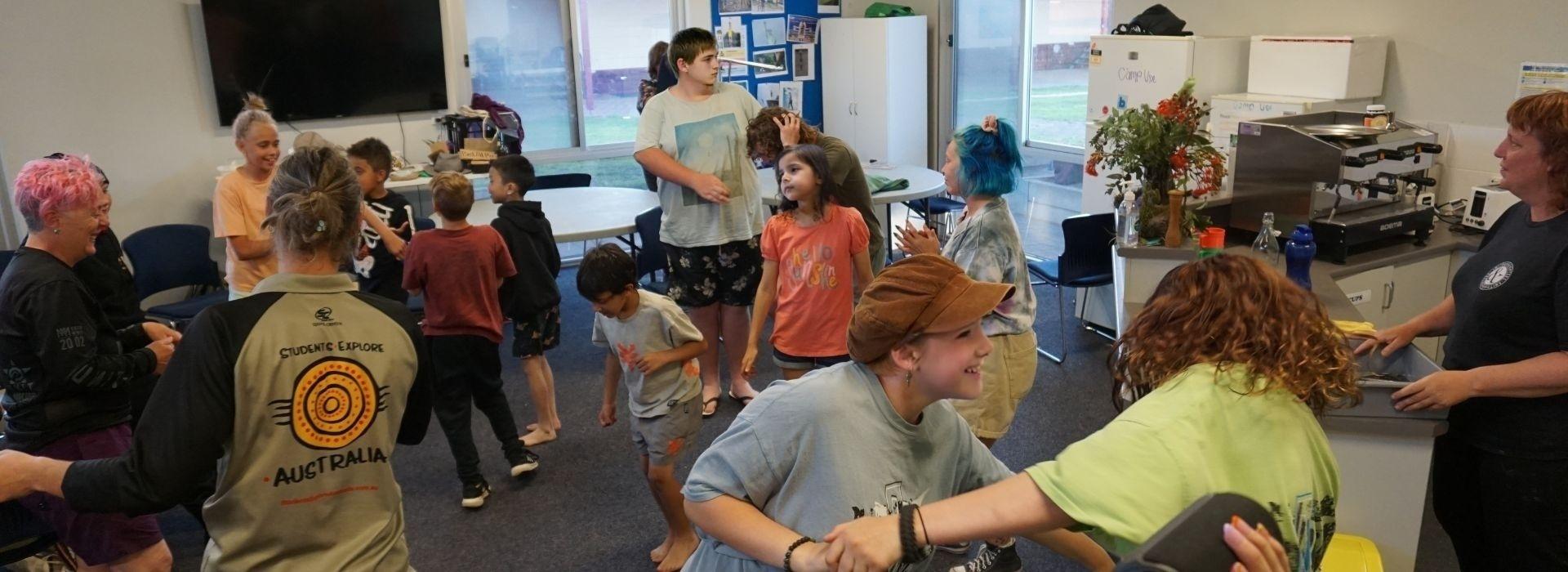 NDIS Participants dancing and having a great time with program facilitators.