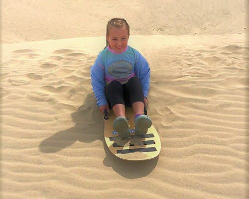 Girl Sand Tobogganing